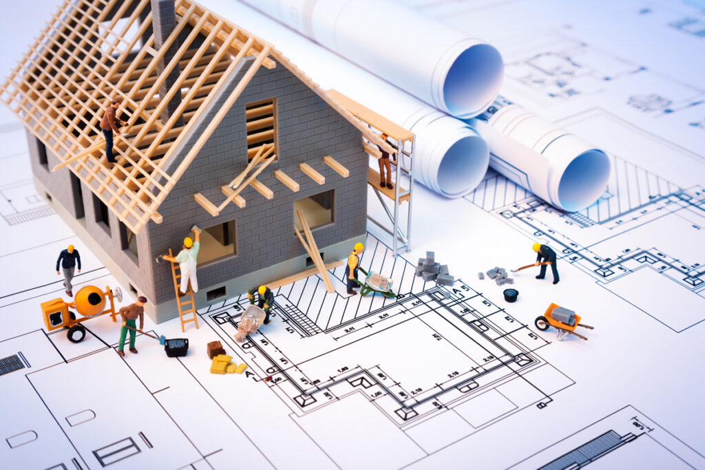 A graphic of a blueprint with a small building and people building it in Meridian.